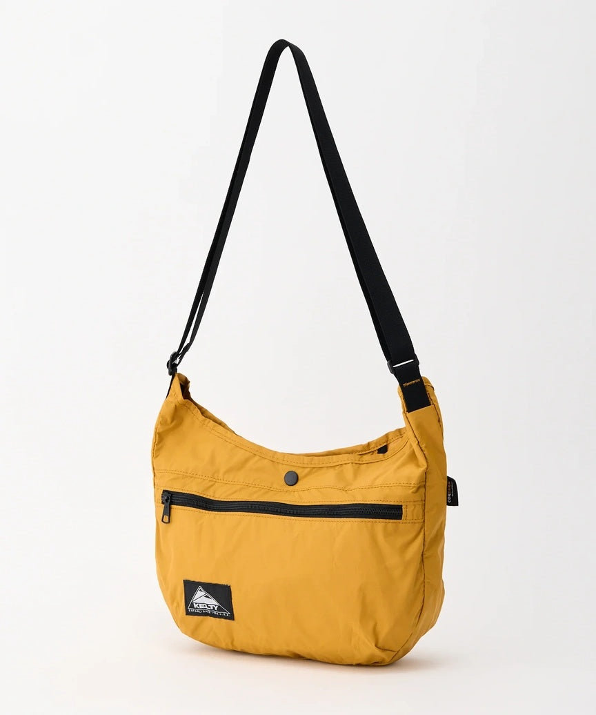 KT_3259273626_PACKABLECURVESHOULDERS_Caramel_1.jpg